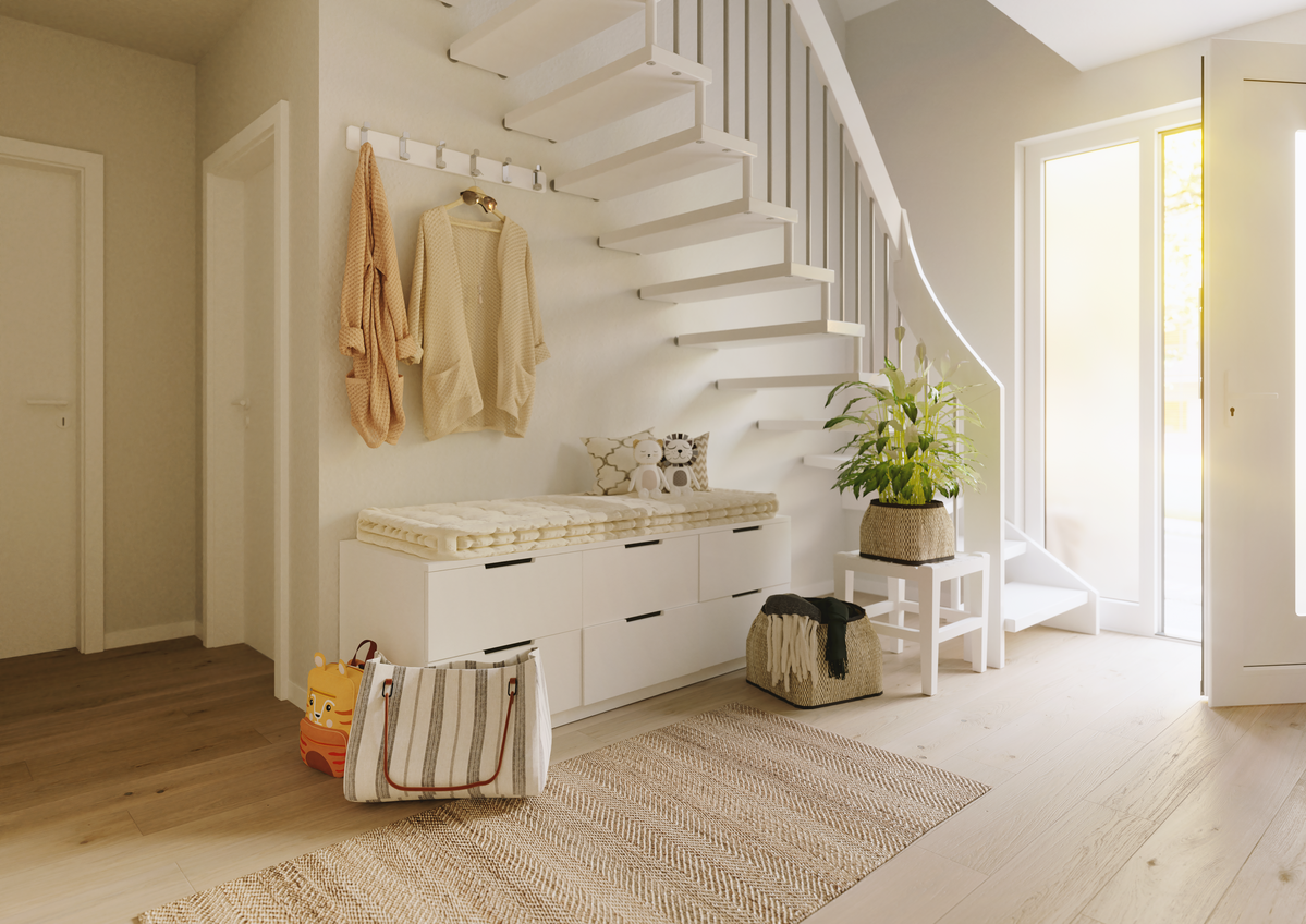 Innenansicht Flair 134: Treppe, Haustür und Garderobe Innenansicht des Einfamilienhauses Flair 134, mit Blick auf die elegante Treppe, eine moderne Haustür und eine stilvolle Garderobe - einladend und funktional zugleich.